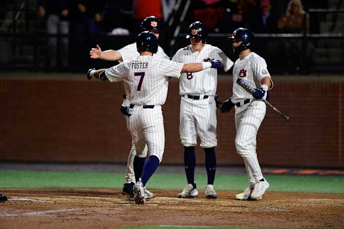 Auburn baseball celebrates after a Cole Foster home run against Alabama State.